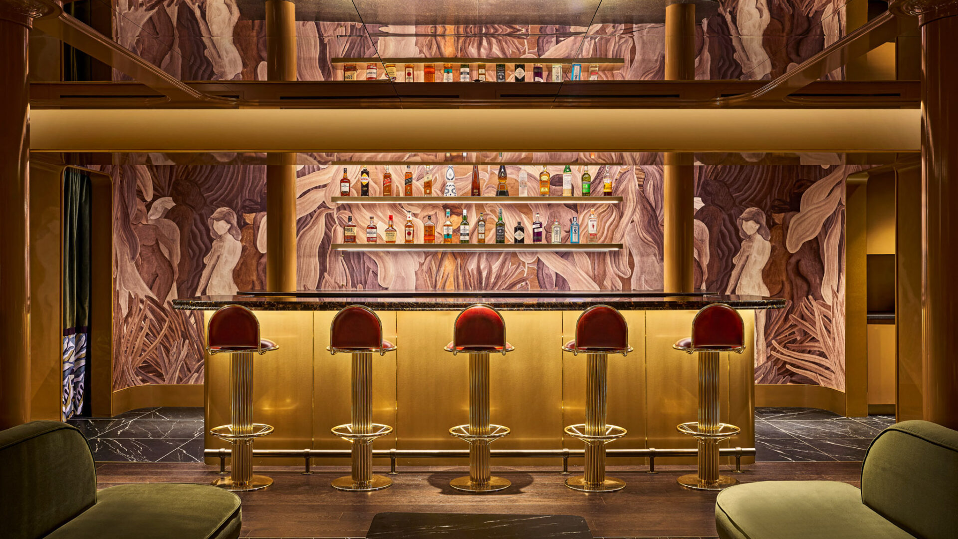 Modern restaurant bar design with golden yellow leather stools and warm wood paneling in Detroit hospitality space