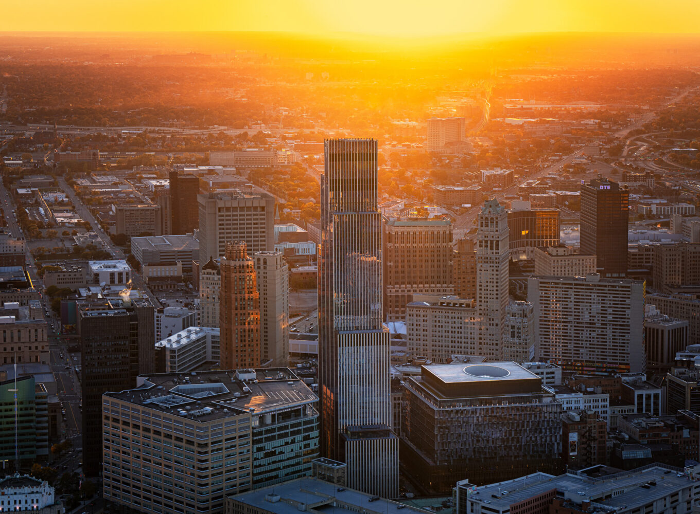 Detroit cityscape at sunset showcasing urban commercial architecture and mixed-use developments in downtown Detroit